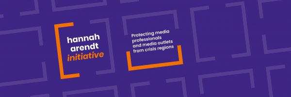 Logo of Hannah Arendt Initiative in orange and violet plus claim: "Protecting media professionals and media outlets from crisis regions".